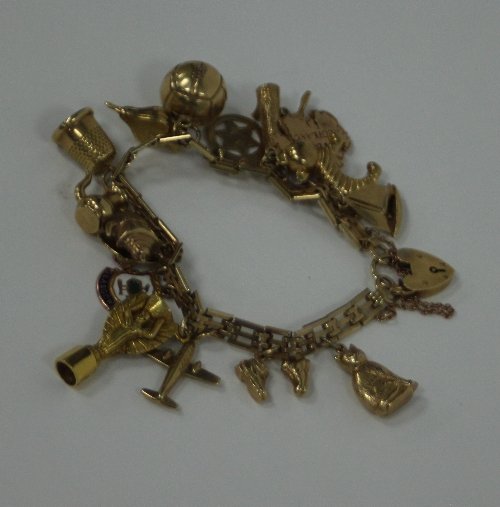 Appraisal: A ct gold charm bracelet the ct gold gate-link bracelet