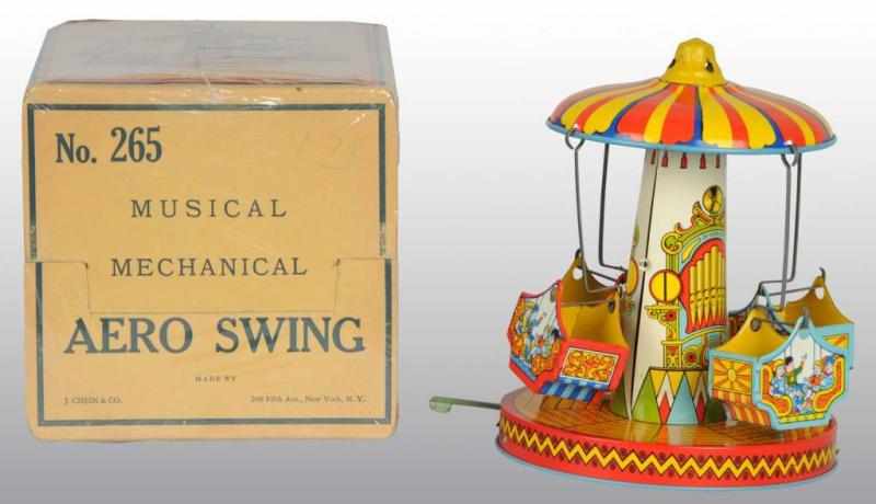 Appraisal: Tin Chein Musical Aero Swing Wind-Up Toy Description American Working