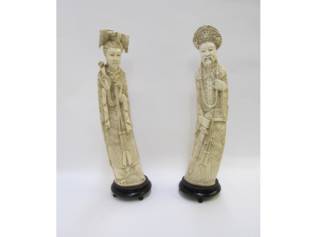 Appraisal: Pair of Chinese resin figures of a Chinese man and