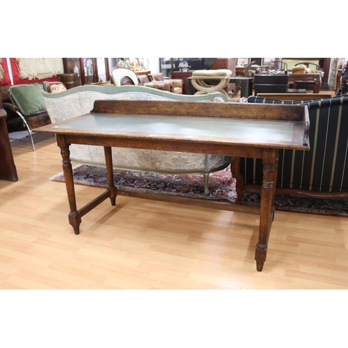 Appraisal: Desk with metal top with backboard standing on cross stretcher