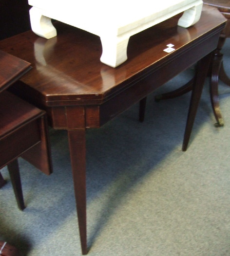 Appraisal: A George III mahogany card table the canted rectangular top