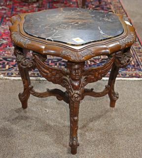 Appraisal: Continental carved figural occasional table having an an inset variegated