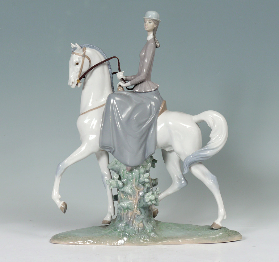 Appraisal: LLADRO PORCELAIN FIGURINE ''FEMALE EQUESTRIAN'' Fulgencio Garcia sculptor issued retired