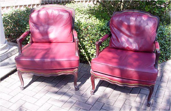 Appraisal: PAIR CONTEMPORARY RED LEATHER BERGERE CHAIRS Dark mahogany wood frame