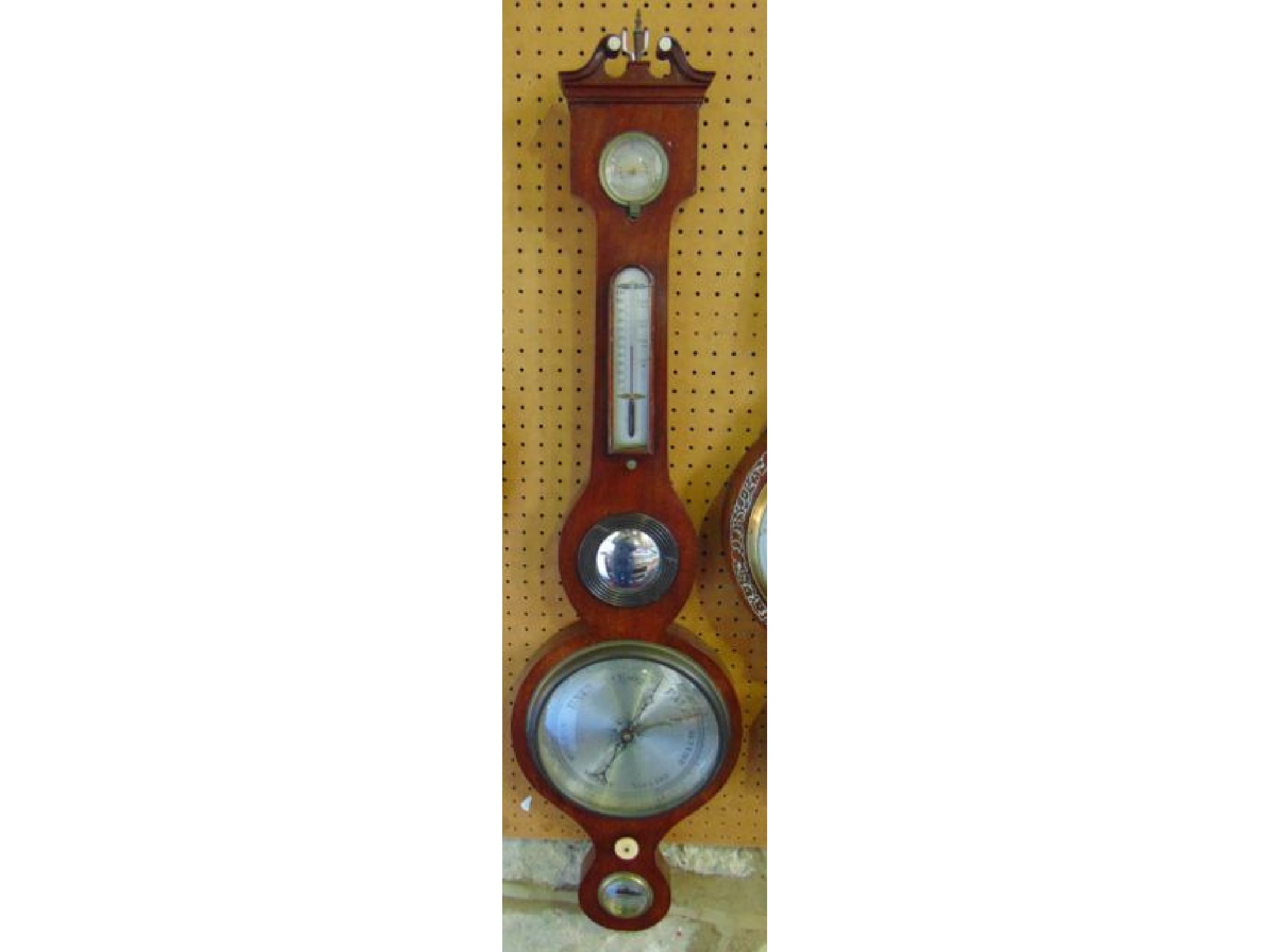 Appraisal: A mid th century mahogany wheel barometer with silvered dials