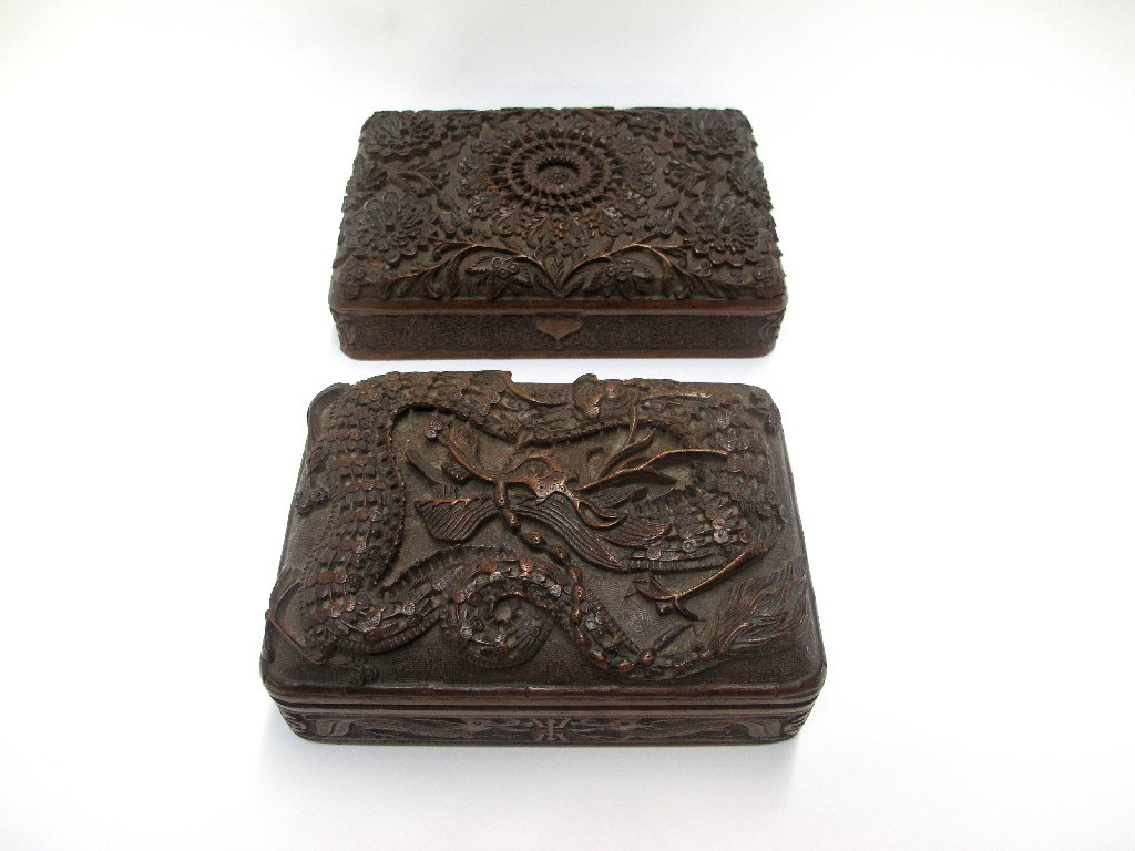 Appraisal: Two oriental carved wood cigarette boxes one with floral decoration