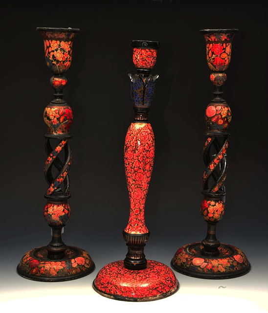 Appraisal: A PAIR OF KASHMIRI POLYCHROME FLORAL PAINTED CANDLESTICKS with open