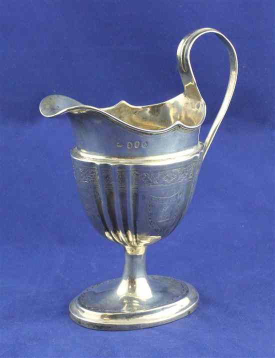 Appraisal: A George III Irish silver pedestal cream jug of fluted