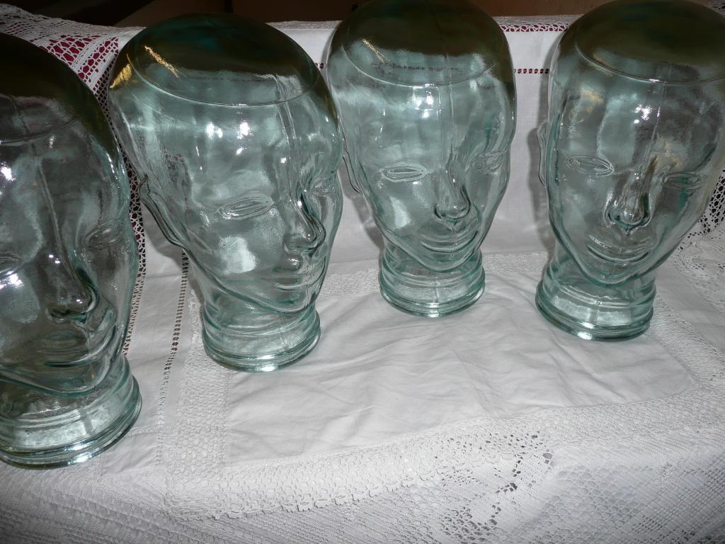 Appraisal: Five glass shop display heads