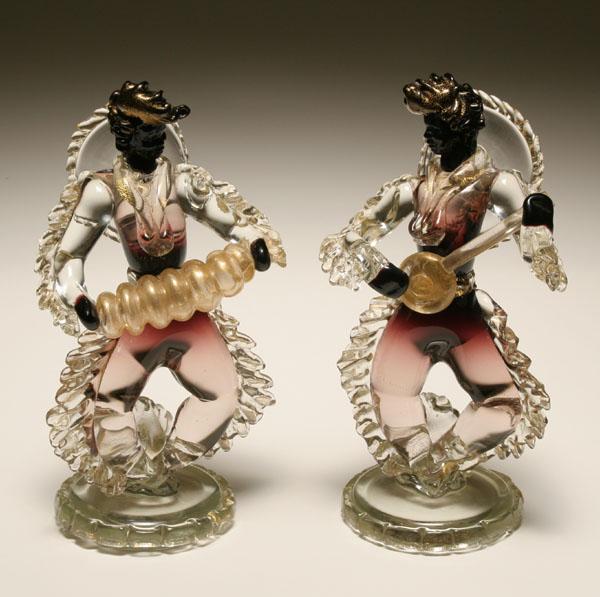 Appraisal: Murano Sommerso glass musicians Black faces with cranberry shaded and