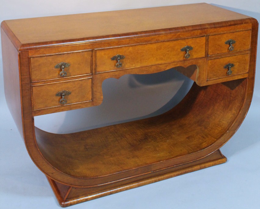 Appraisal: An Art Deco birds-eye maple veneered side table in the