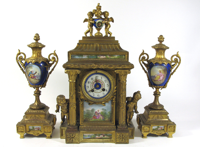 Appraisal: FRENCH THREE-PIECE CLOCK SET The gilt metal cased center clock