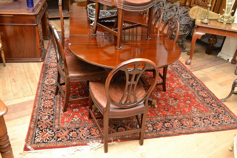 Appraisal: A TRADITIONAL FLOOR RUG IN RED BLUE AND CREAM FLORAL