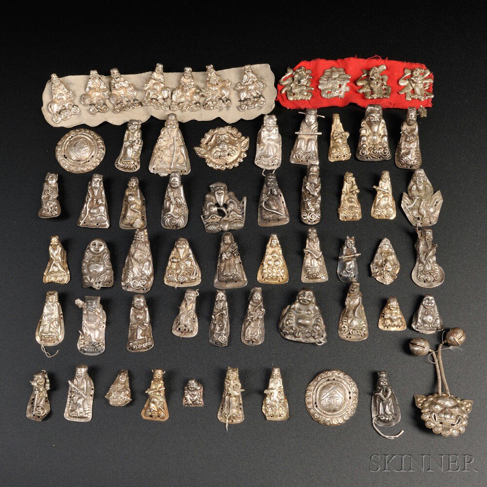 Appraisal: Approximately Sixty Silver Hat Ornaments China th century most in