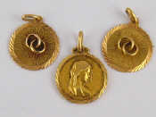 Appraisal: Three yellow metal test ct gold pendants each approx cm