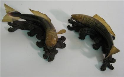 Appraisal: Pair carved carp on stands L in