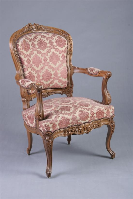 Appraisal: LOUIS XV STYLE CARVED WALNUT FAUTEUIL th century Crested cartouche-form