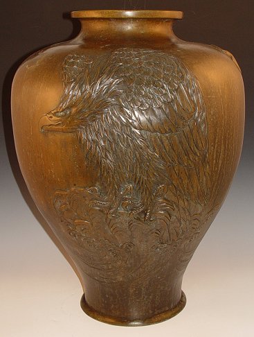 Appraisal: JAPANESE EAGLE BRONZE VASE Relief Eagle Design imperfection in vase