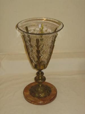 Appraisal: A GILT METAL URN with diamond cut clear glass liner