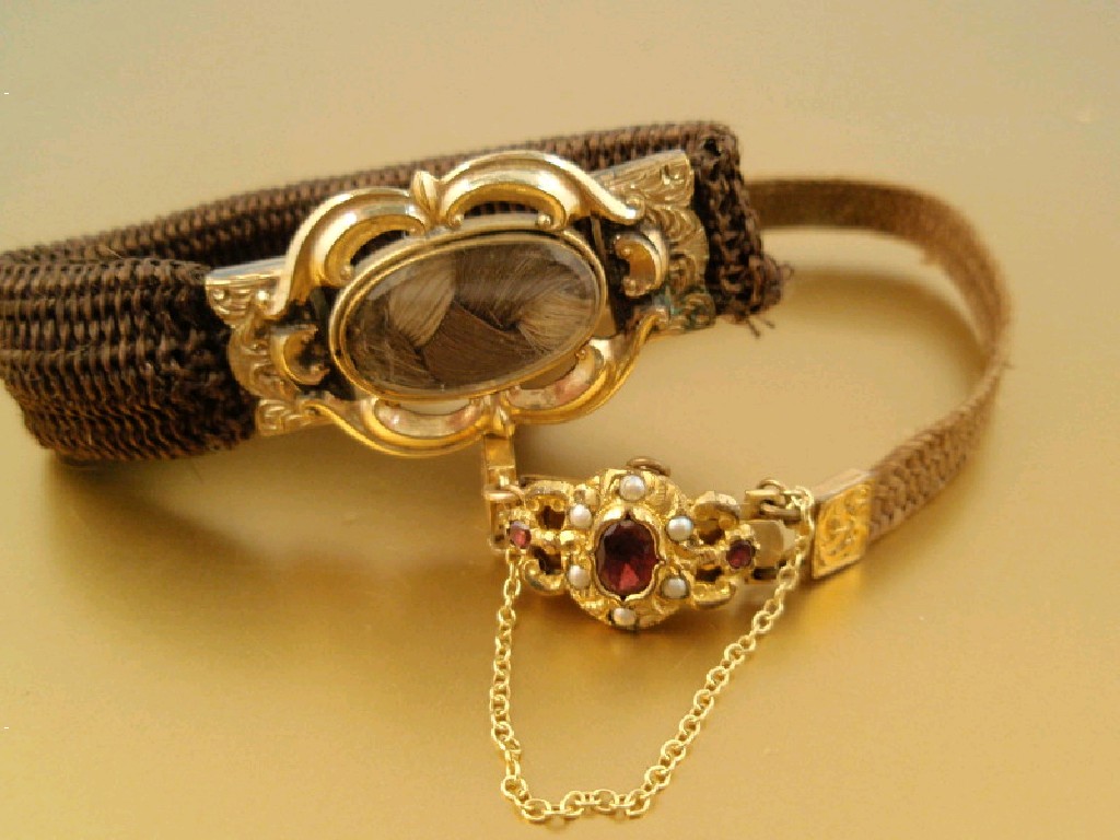 Appraisal: Two Victorian memorial woven hair bracelets with yellow metal clasps