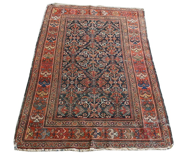 Appraisal: A MAHAL RUG the central blue ground with stylised foliate