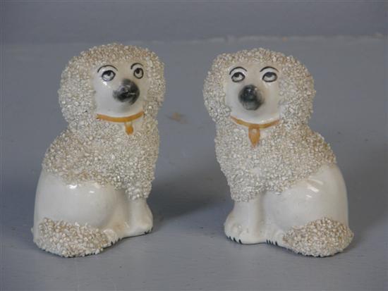 Appraisal: Pair of Staffordshire pottery miniature poodles PROVENANCE Thetis Blacker h