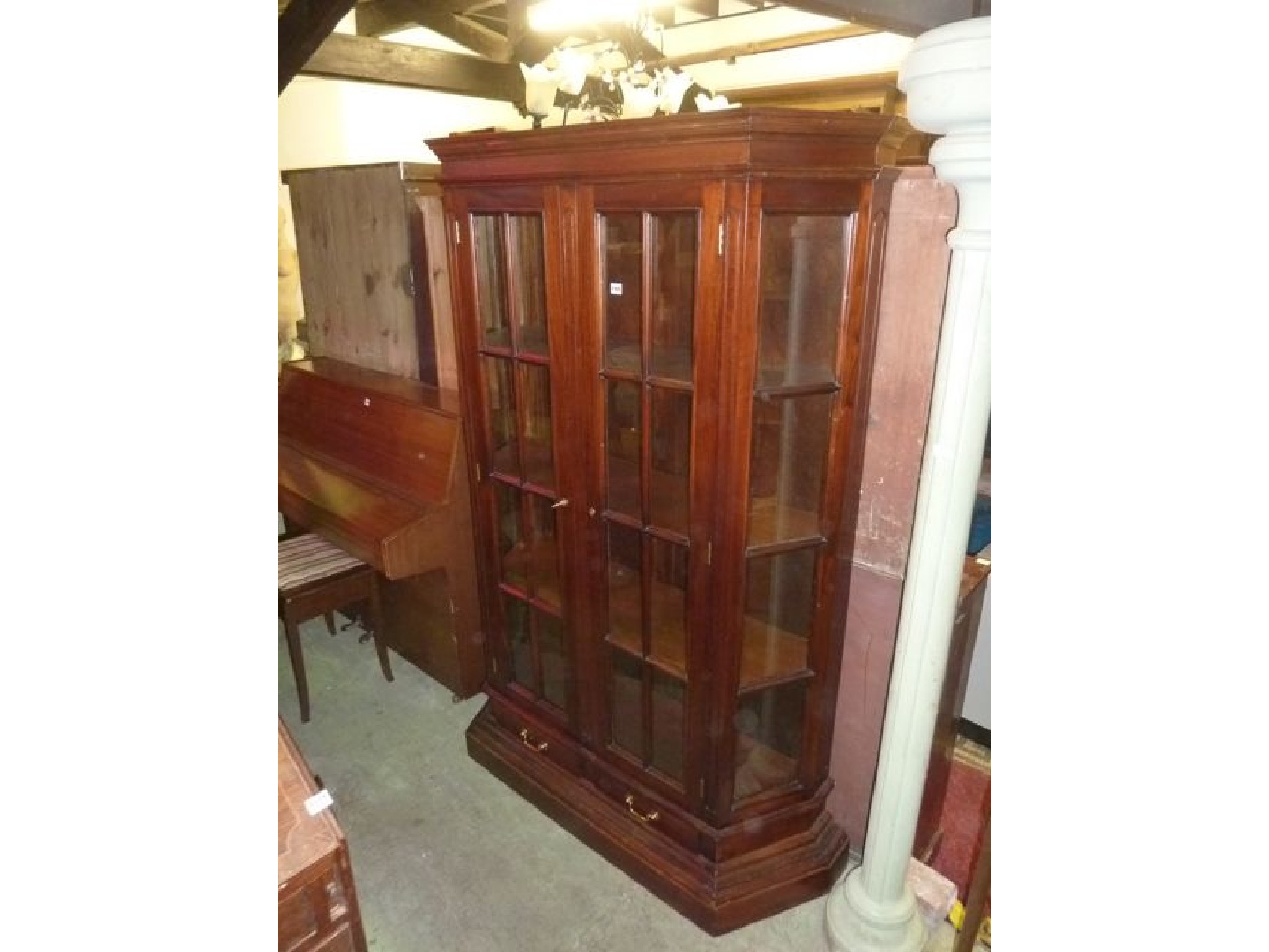 Appraisal: A hardwood freestanding breakfront side cabinet enclosed by a pair