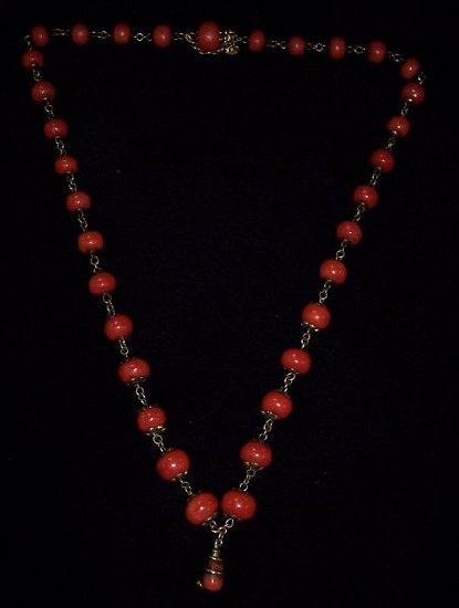 Appraisal: A Victorian coral bead necklace with a single drop entwined