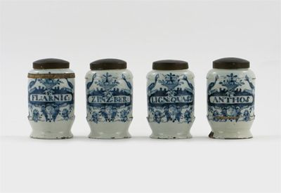 Appraisal: A set of four small Delft drug jars with metal