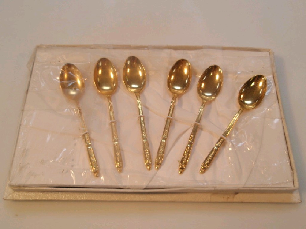 Appraisal: A set of continental metal teaspoons with pendant foliate handles