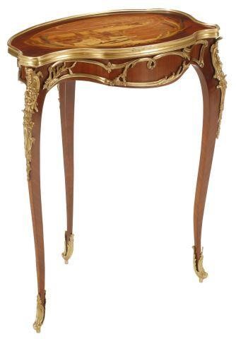 Appraisal: French Louis XV style cartouche shaped marquetry table with bronze