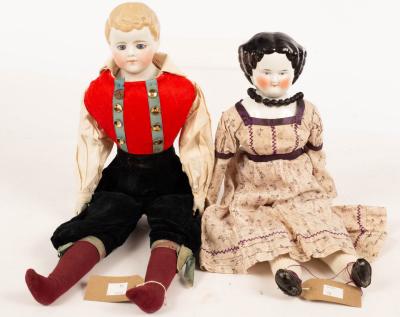 Appraisal: A French porcelain head doll and a bisque head doll