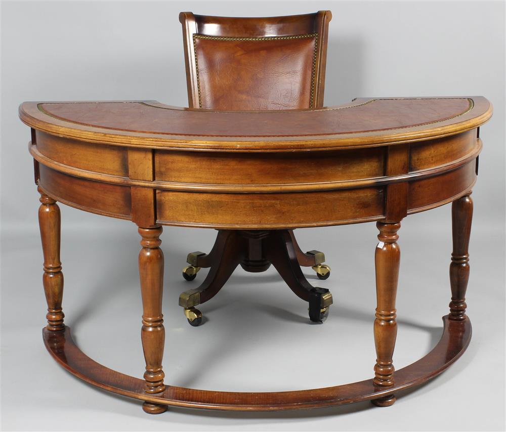 Appraisal: VICTORIAN STYLE SEMI-CIRCULAR LEATHER-INSET WALNUT DESK WITH MATCHING CHAIR the