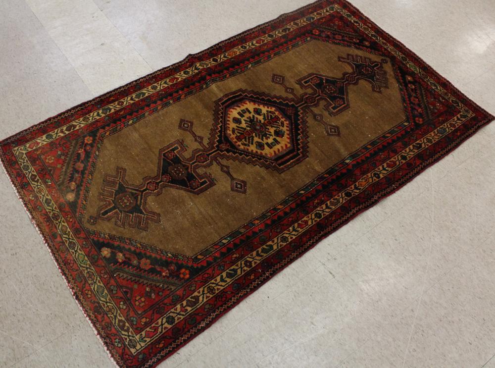 Appraisal: SEMI-ANTIQUE PERSIAN AREA RUG geometric pole medallion on plain camel