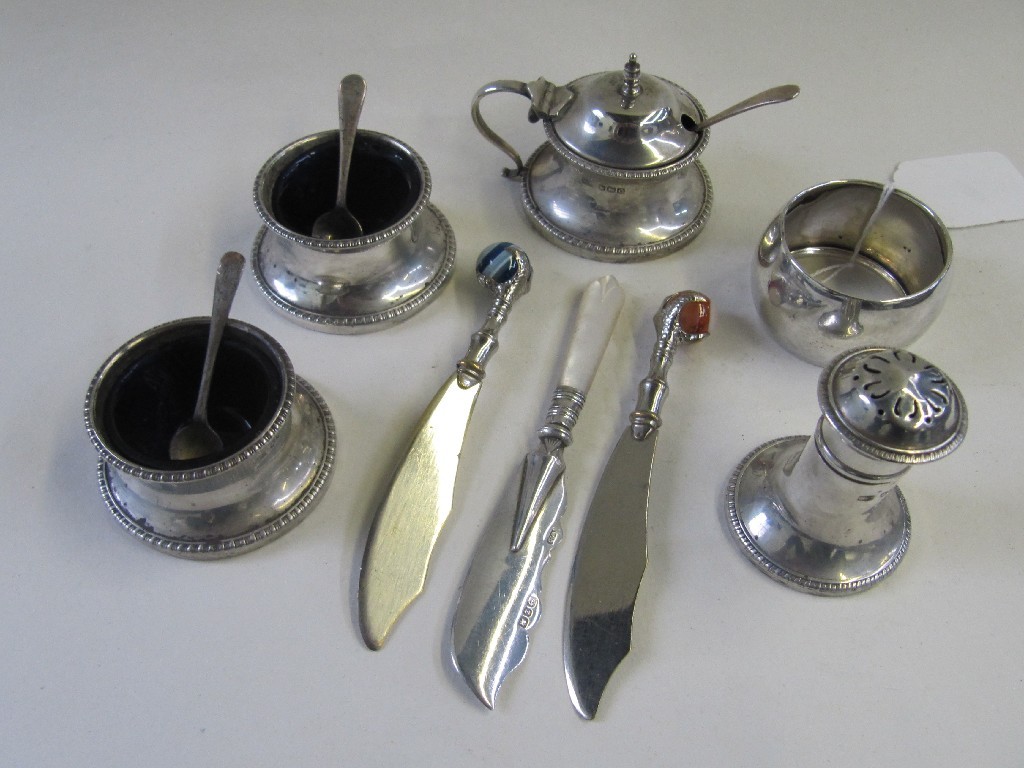 Appraisal: Lot comprising four piece silver condiment set Sheffield silver napkin