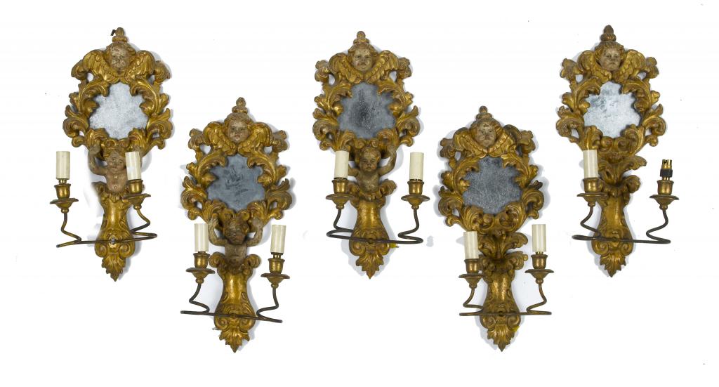 Appraisal: A SET OF FIVE CONTINENTAL GILTWOOD GIRANDOLES carved with putti