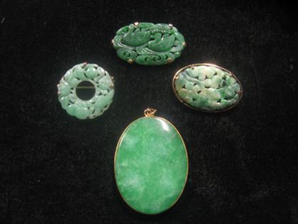 Appraisal: Group of jade brooches and pendant Three brooches and one