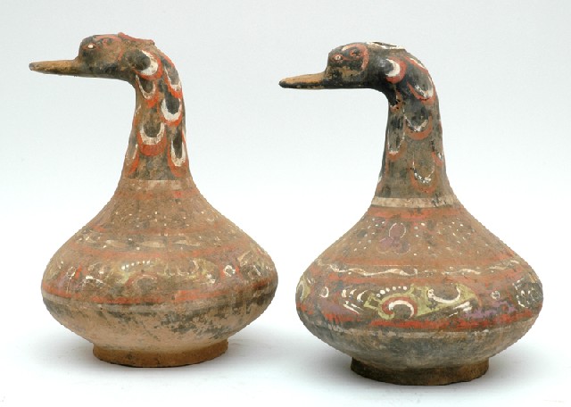 Appraisal: TWO CHINESE POLYCHROME TERRACOTTA DUCK FIGURES Han Dynasty BC -