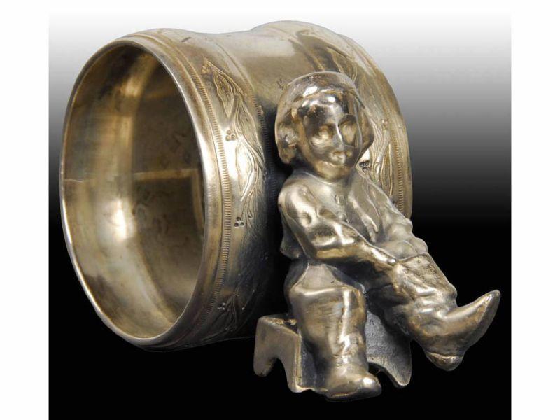 Appraisal: Small Boy with Boots Figural Napkin Ring Description No manufacturer's