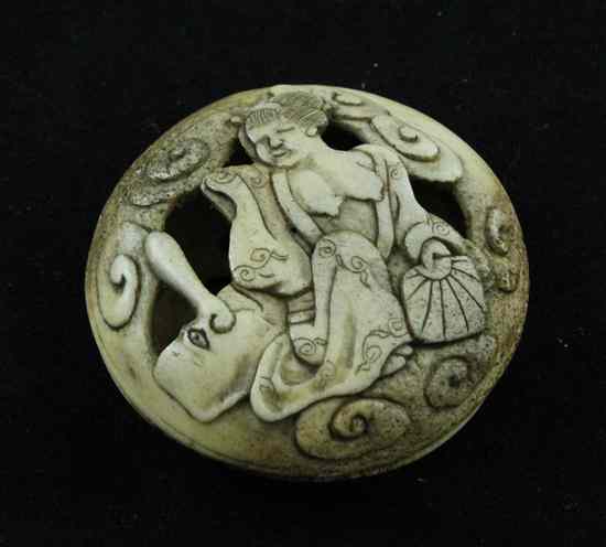 Appraisal: A Meiji period staghorn manju netsuke carved in low relief