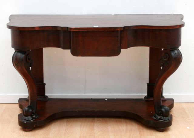 Appraisal: A Victorian mahogany carved and shaped console table x x