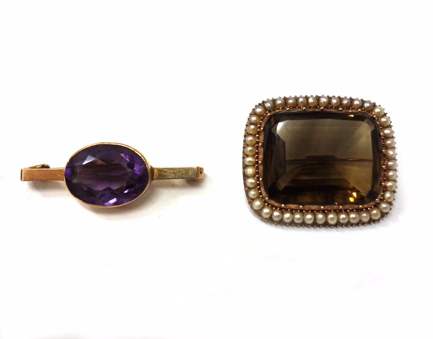 Appraisal: Two gold and quartz brooches comprising an oval mixed cut