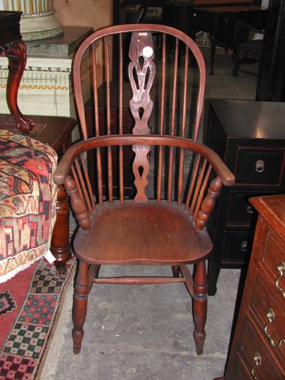 Appraisal: English Elmwood Plank-Seat Windsor Armchair ca the back with a