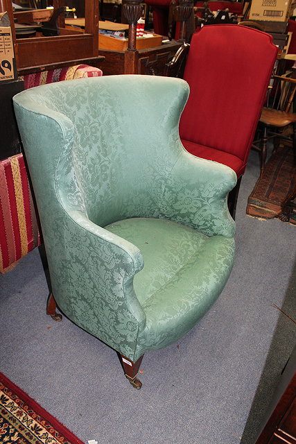 Appraisal: A PAIR OF GREEN UPHOLSTERED TUB ARMCHAIRS with square tapering