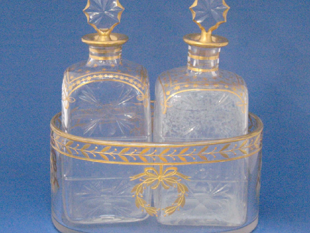 Appraisal: A PAIR OF CONTINENTAL CUT AND GILT DECORATED DECANTERS with