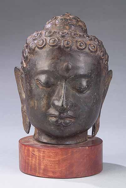 Appraisal: An Antique Southeast Asian Bronze Head of Buddha with curled