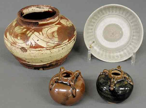 Appraisal: Four pieces of early Asian porcelain pottery th c Jar