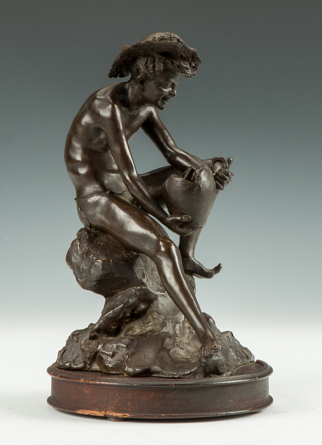 Appraisal: Gabriele Parente Italian th century Bronze of a Seated Boy