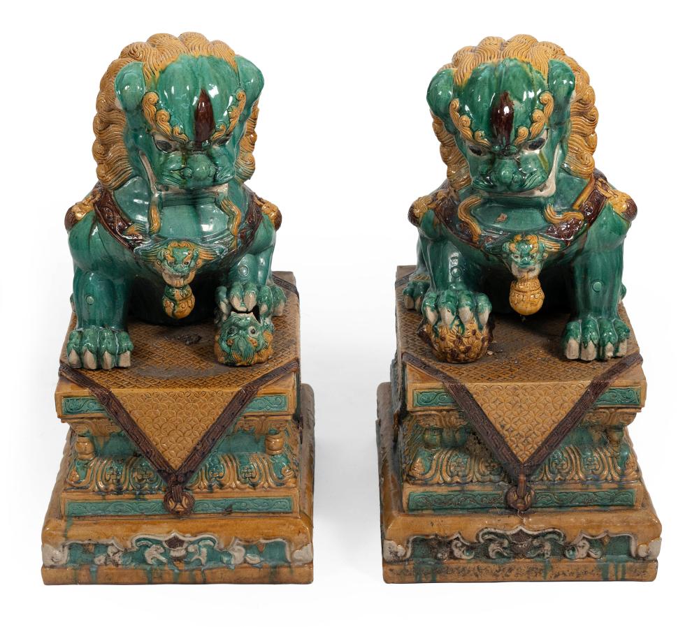 Appraisal: PAIR OF CHINESE CERAMIC SEATED FU LIONS ON CONFORMING PEDESTALS