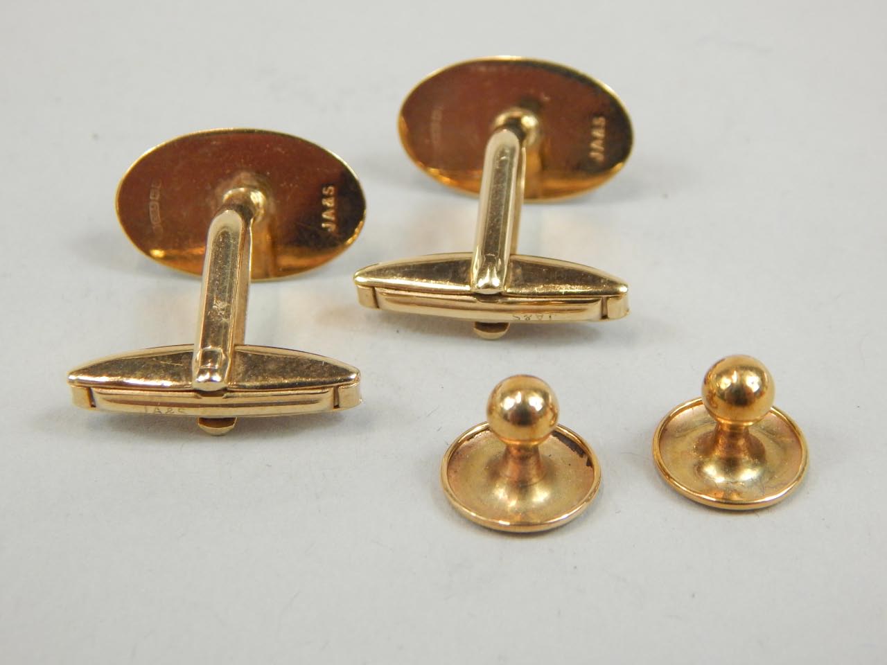 Appraisal: A gentleman's ct gold cuff link and shirt stud set